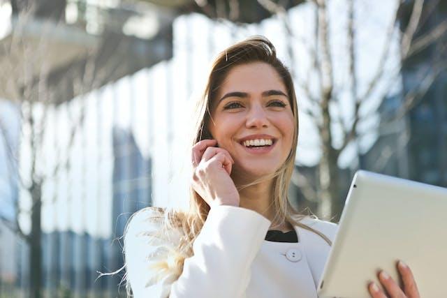 A person on a phone call smiling